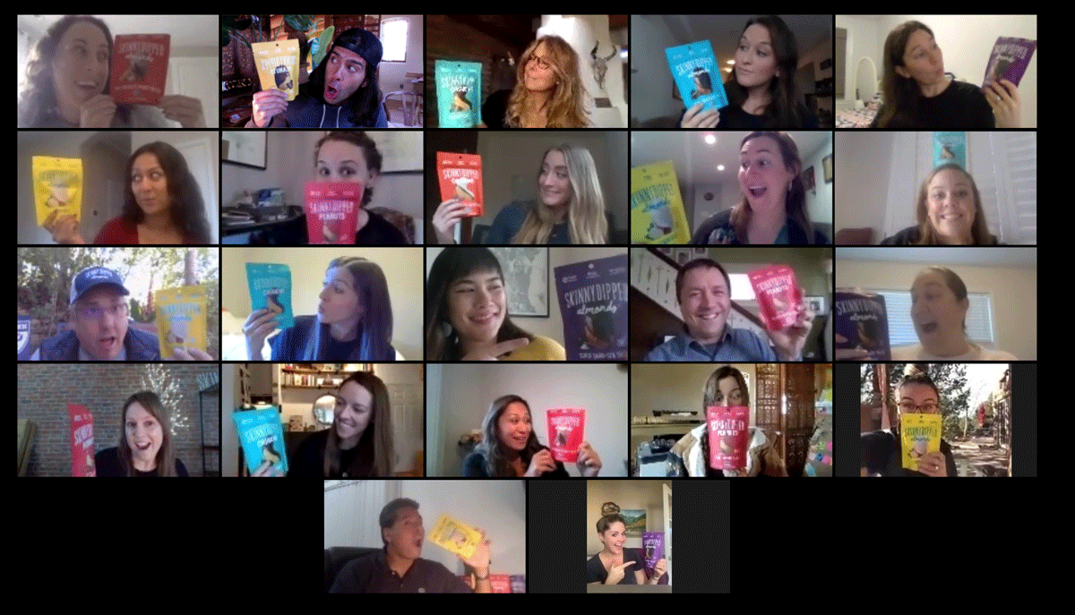 The whole SkinnyDipped team holding up their favorite SkinnyDipped on a Zoom call.